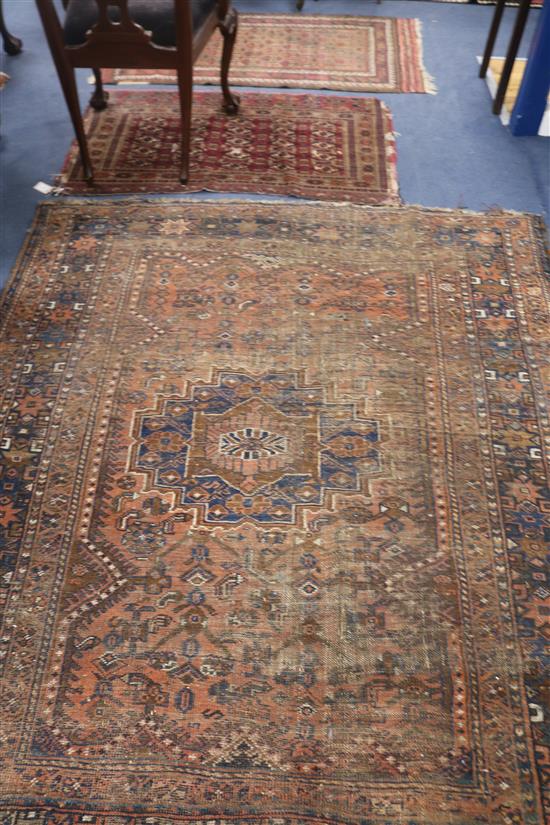 A Shiraz rug, a Bokhara saddlecloth and another rug (wear)
